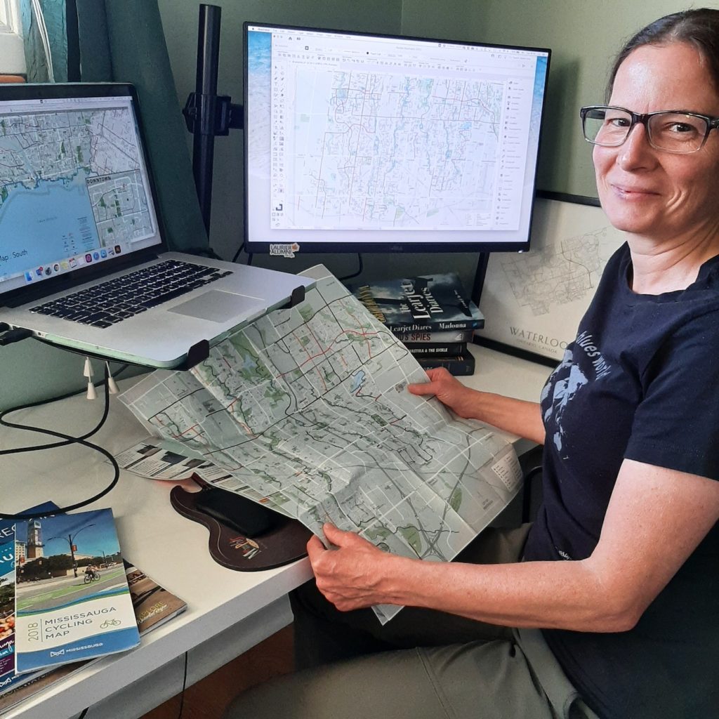 Julie Witmer sitting at a computer using MAPublisher